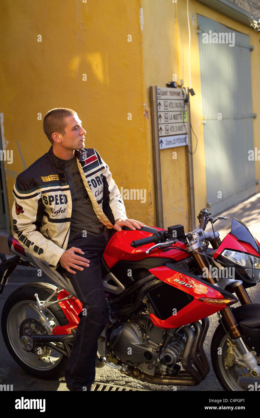 Motorcycle driver takes a break Stock Photo Alamy
