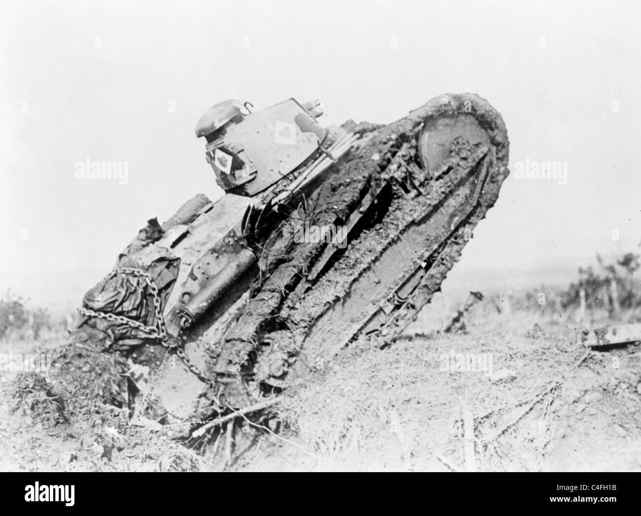 Tank in action passing a trench and starting toward the German line, during World War I, France Stock Photo