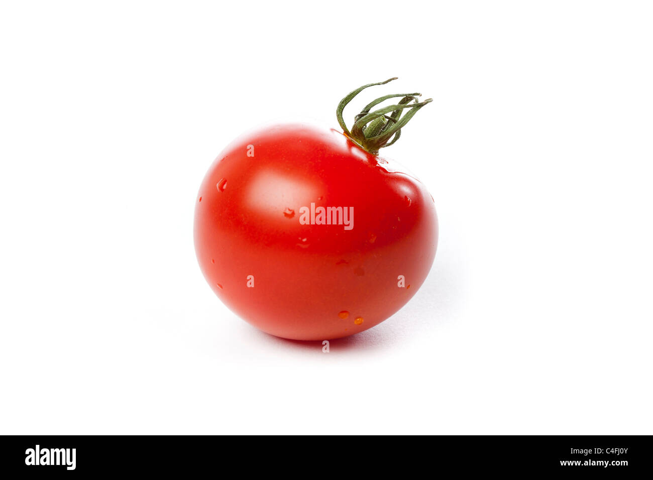 Fresh Red Ripe tomatoes against a white background Stock Photo