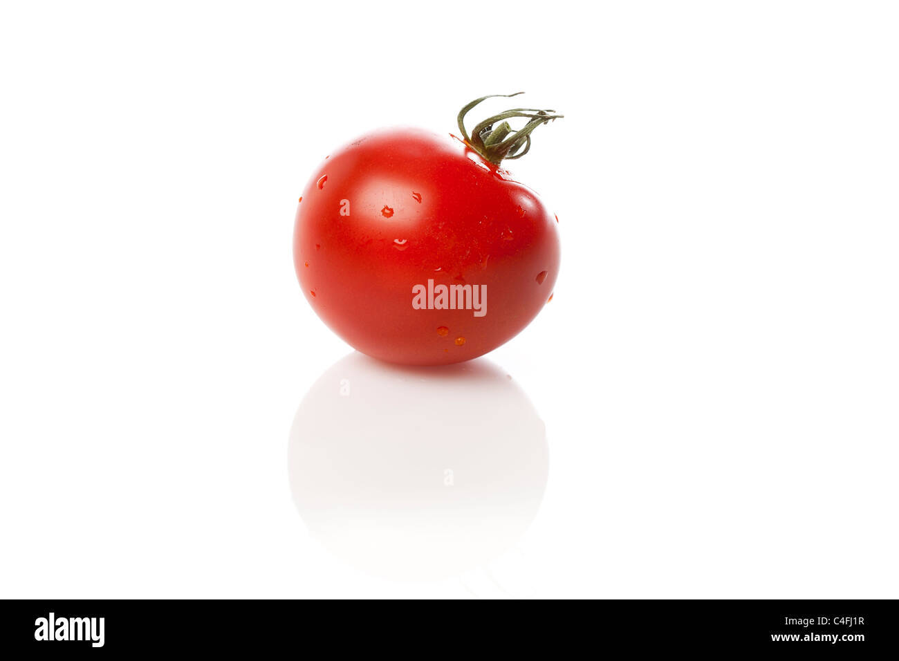 Fresh Red Ripe tomatoes against a white background Stock Photo