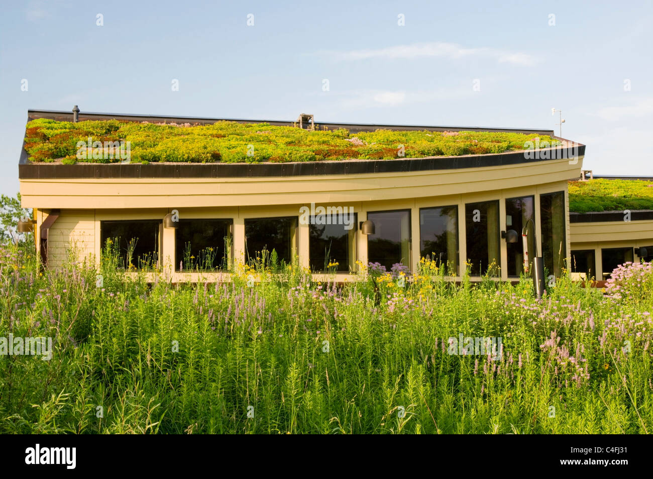 lebanon hills visitor center in eagan minnesota showing vegetation on green roof and garden in foreground Stock Photo