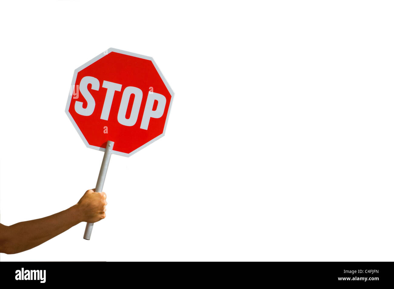 Hand holding stop sign Stock Photo