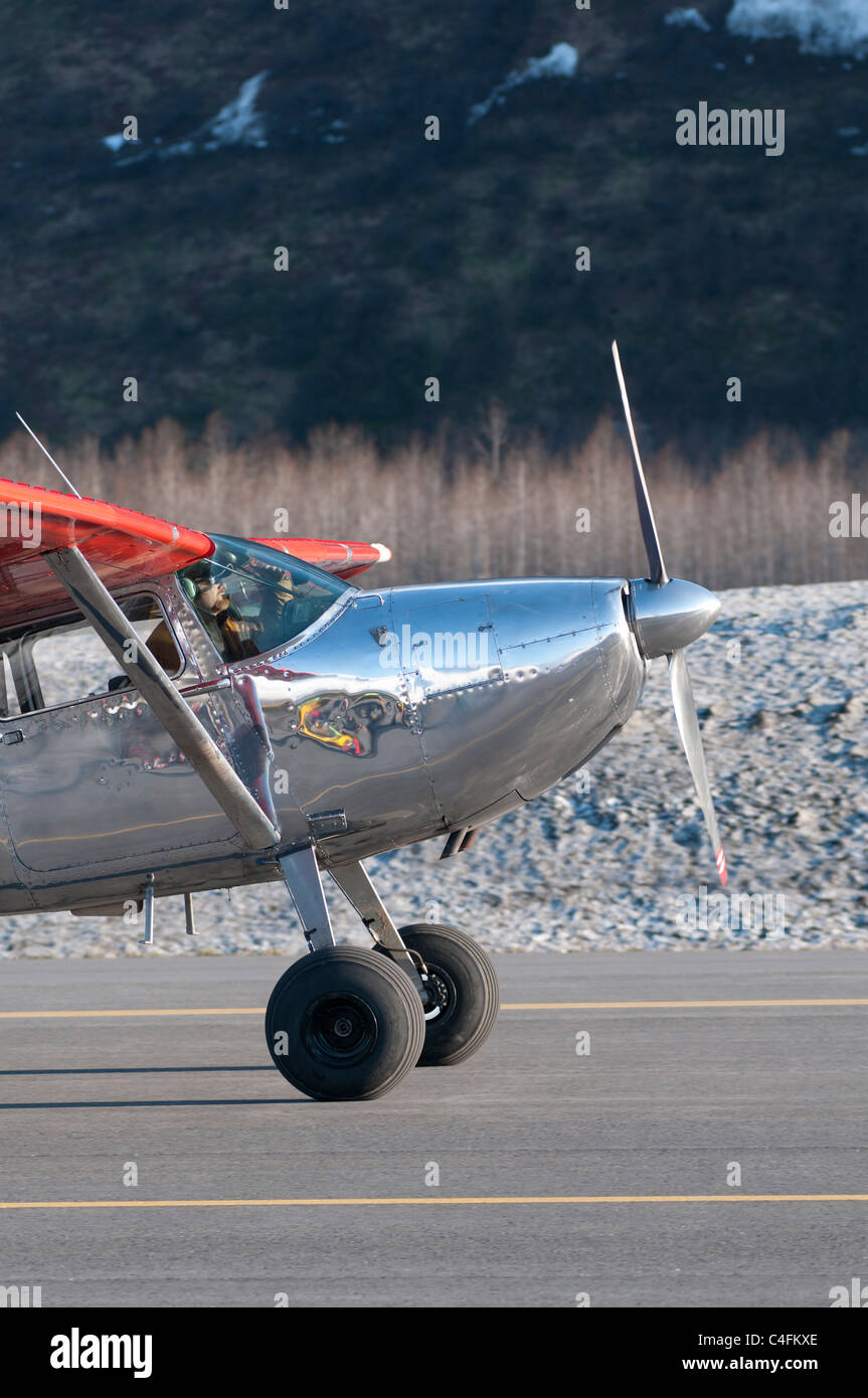 Silver Cessna 185 bush plane on the runway in Valdez, Alaska Stock Photo