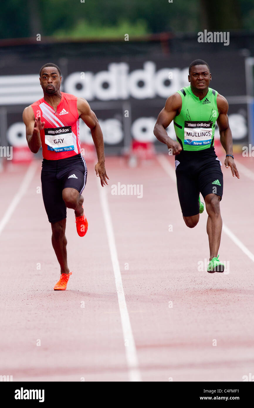 Tyson Gay (USA) and Steve Mullings (JAM) competing in a 100 meters race at the 2011 NYC Grand Prix Track and Field competition. Stock Photo