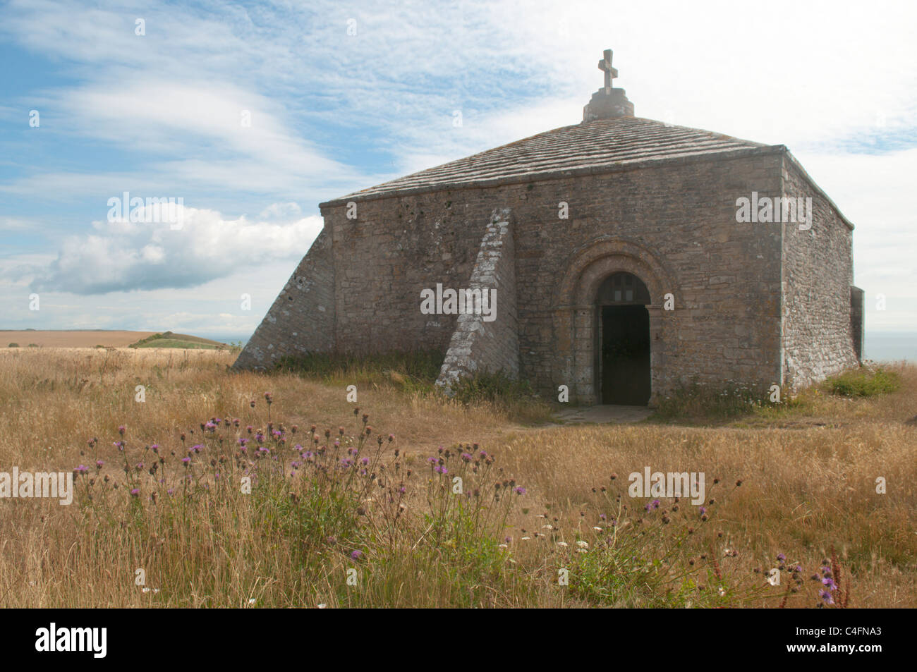 St Aldhelm's Chapel on St Aldhelm's or St Alban's Head, Dorset, UK. July. Stock Photo