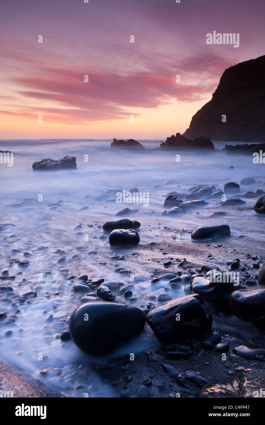 Twilight on the rocky beach at Duckpool on the North Cornish Coastline, Cornwall, England. Spring (March) 2011. Stock Photo