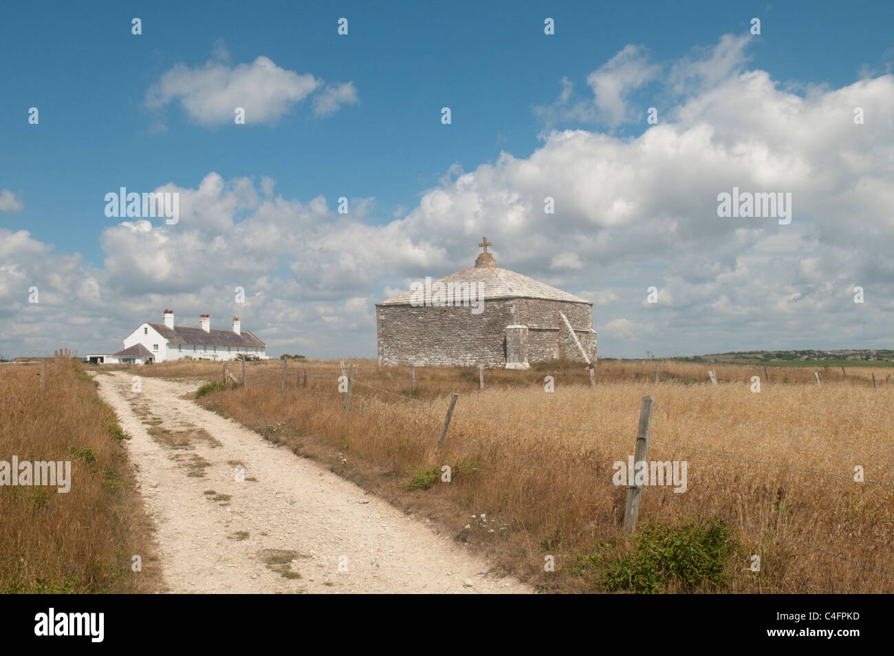 Path leading to St Aldhelm's Chapel and to cottages on St Aldhelm's or St Alban's Head, Dorset, UK. July. Stock Photo