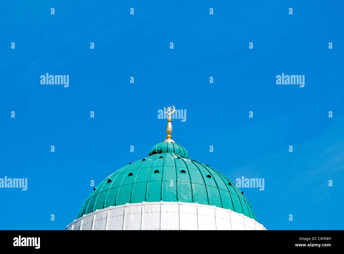 The Green and White Dome of a Mosque in West Yorkshire under a Blue Sky Stock Photo