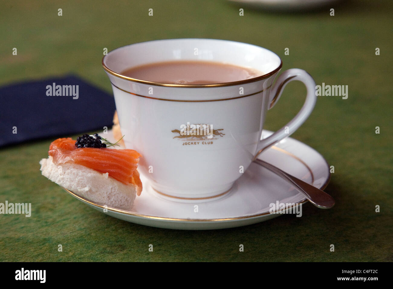 A china cup of tea and smoked salmon canape, The Jockey Club Newmarket Suffolk UK Stock Photo