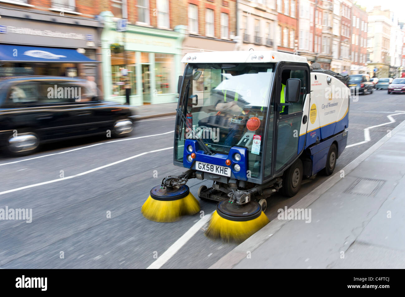 Westminster Council street sweeping vehicle, London, UK Stock Photo