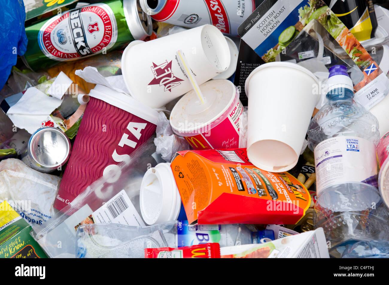 Pile of used disposable plastic fast food and soft drinks containers, UK Stock Photo