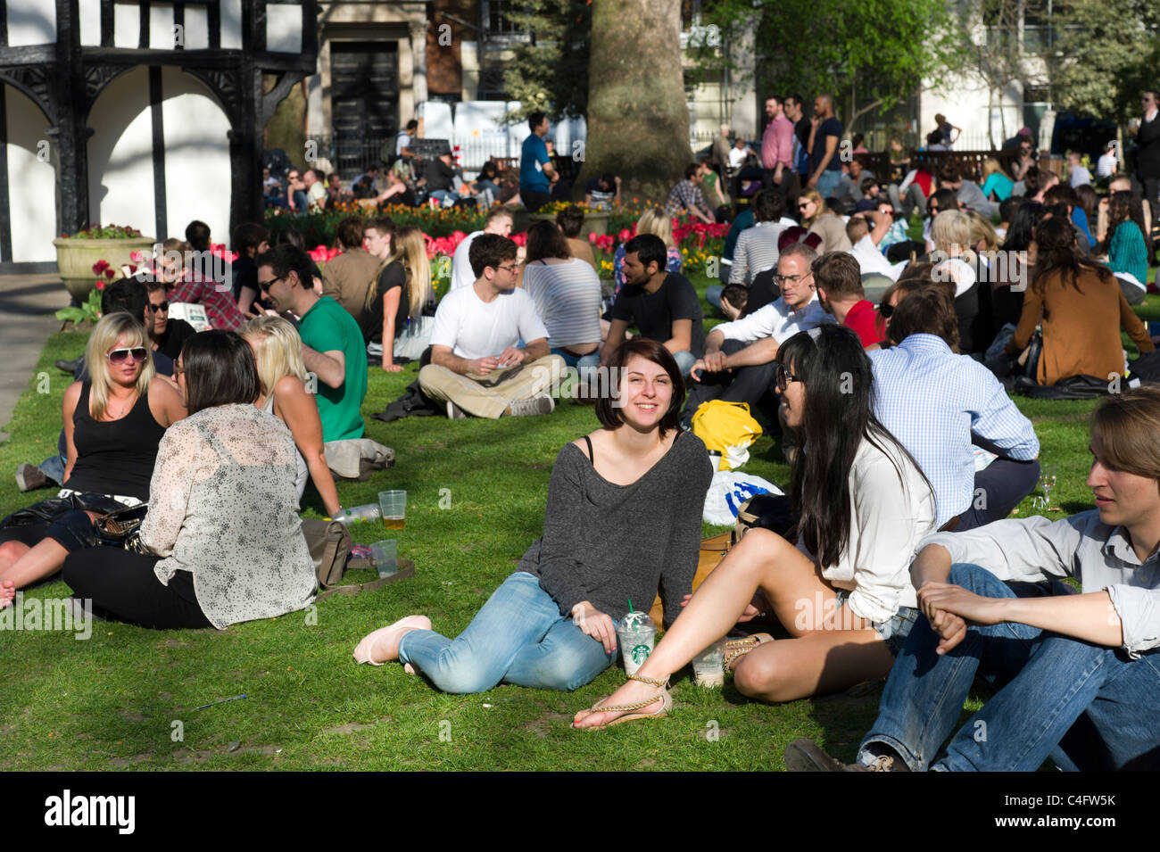 Young people in Soho Square, London, UK Stock Photo