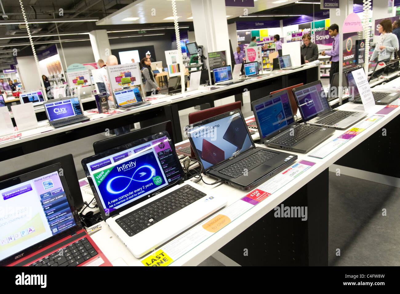 Laptop computers on display in PC World, London, UK Stock Photo