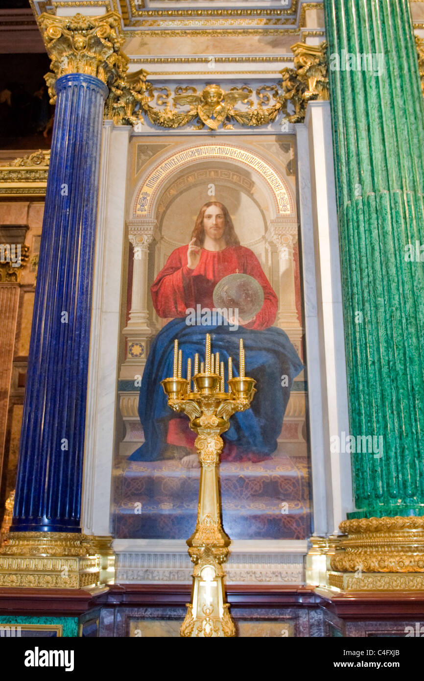 Russia St Petersburg St Isaac's Cathedral built 1858 mosaic panel painting iconostasis & malachite & lapis columns gilt candelabra candles Stock Photo
