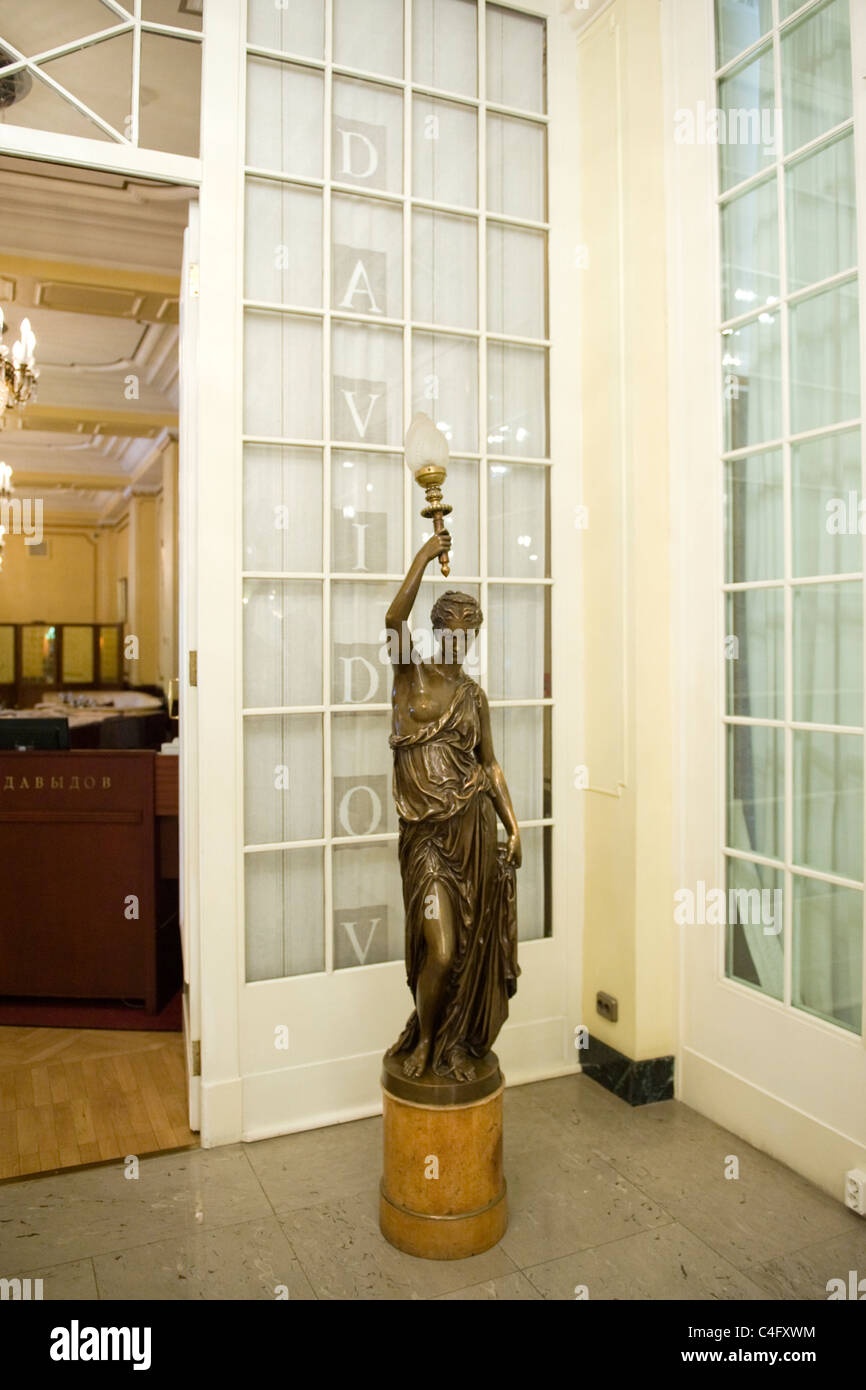 Russia , St Petersburg , Astoria Hotel interior , Davidov restaurant entrance with art decco statue Stock Photo