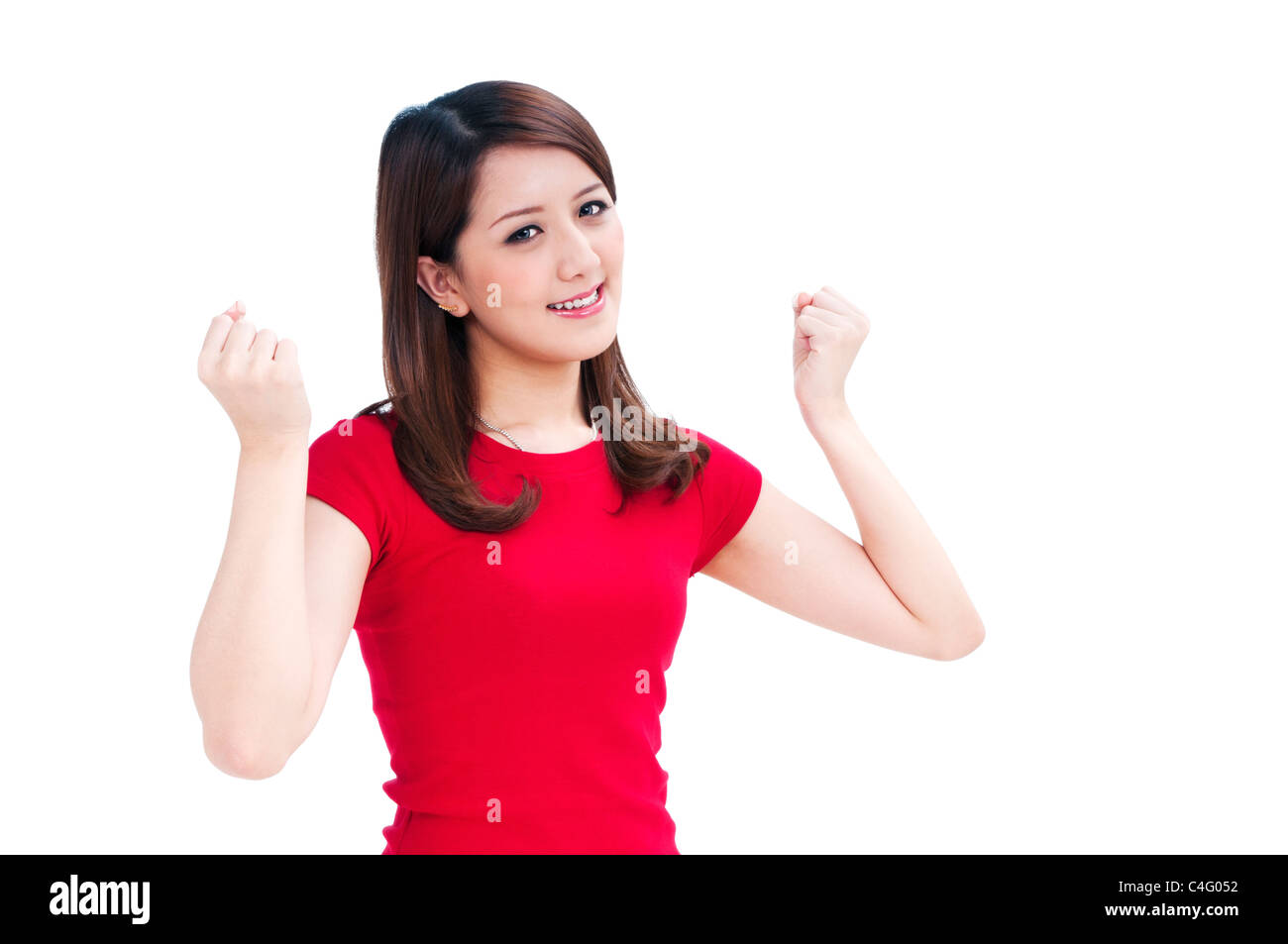 Attractive young woman cheering with her arms raised Stock Photo - Alamy