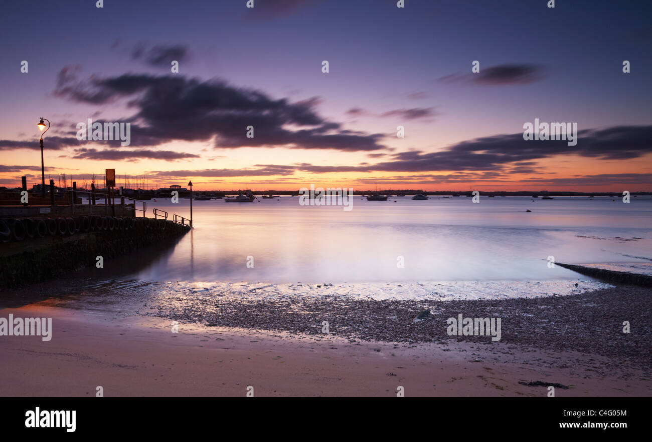 Sunset at Bawdsey Quay looking across the Debben Estuary towards Felixstowe Ferry Stock Photo