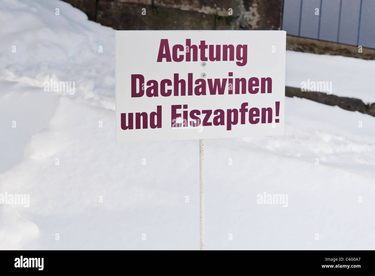 Achtung, Dachlawinen ... | Attention, roof avalanches ... Stock Photo