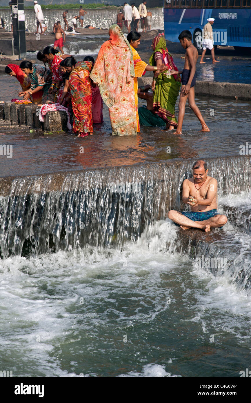 Man bathing in the sacred waters of the Godavari river. Ram Kund. Nasik. Maharastra state. India Stock Photo