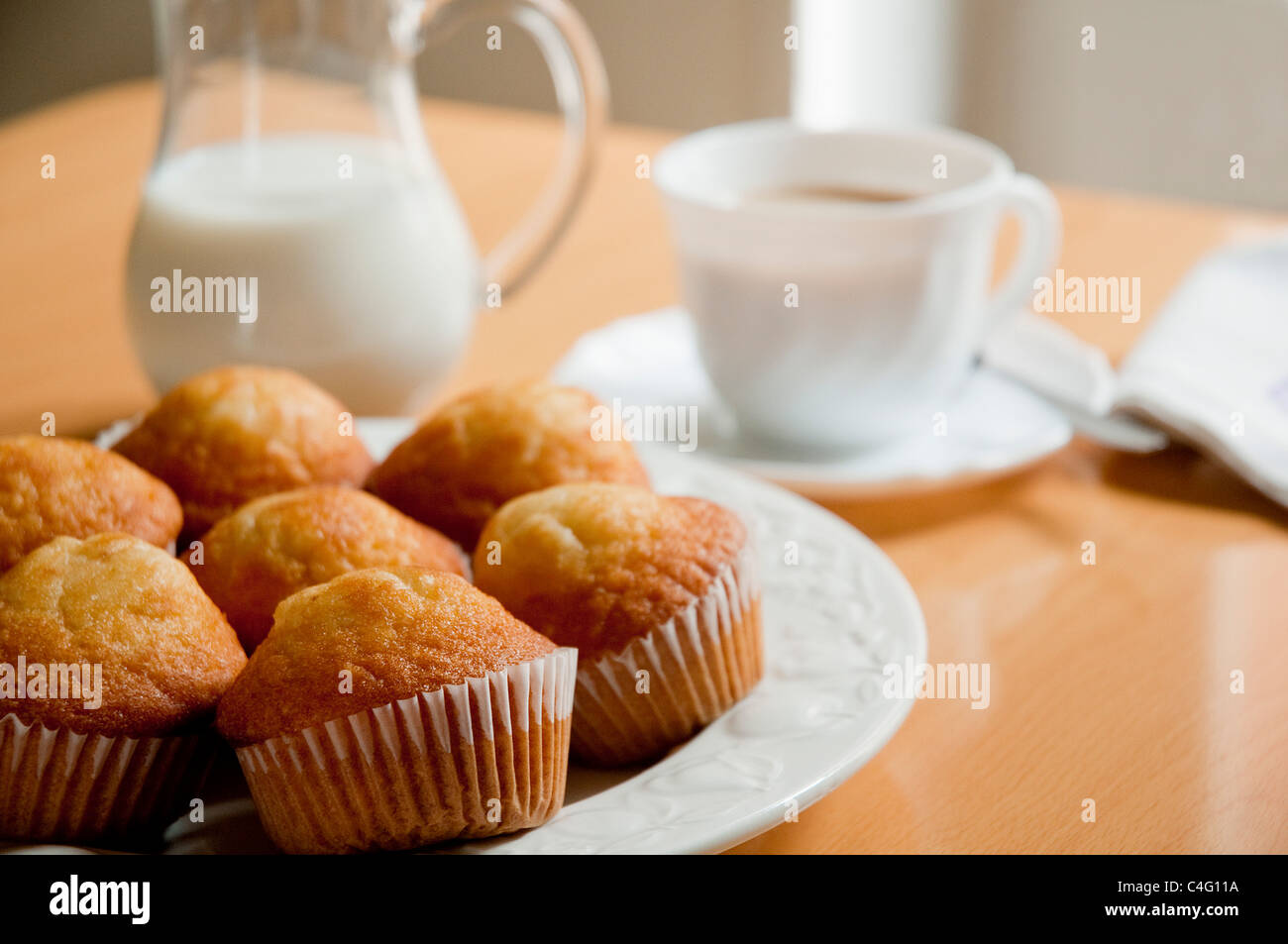 Muffins, small sponge cakes, at breakfast Stock Photo Alamy