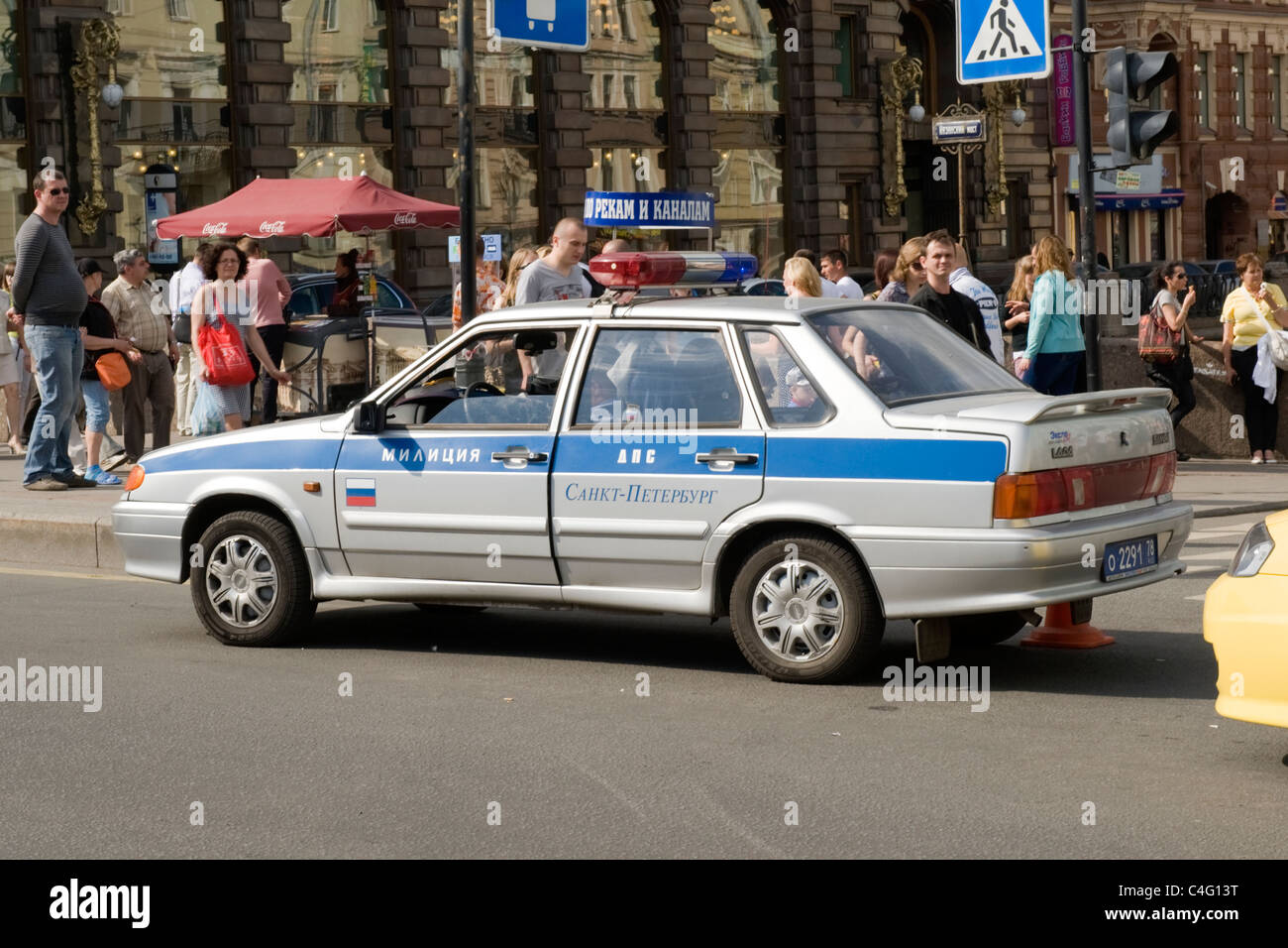 Russia St Petersburg crowded Nevskiy Prospekt , Lada police car stops ...