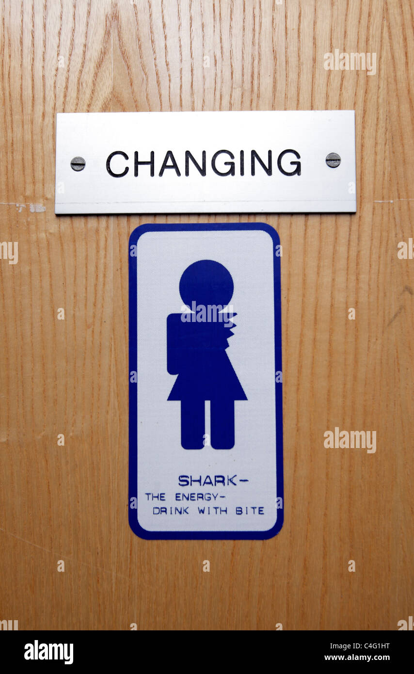 Humorous sign on the changing room door at Deep Sea World aquarium, where the main attractions are their seven sharks. Stock Photo