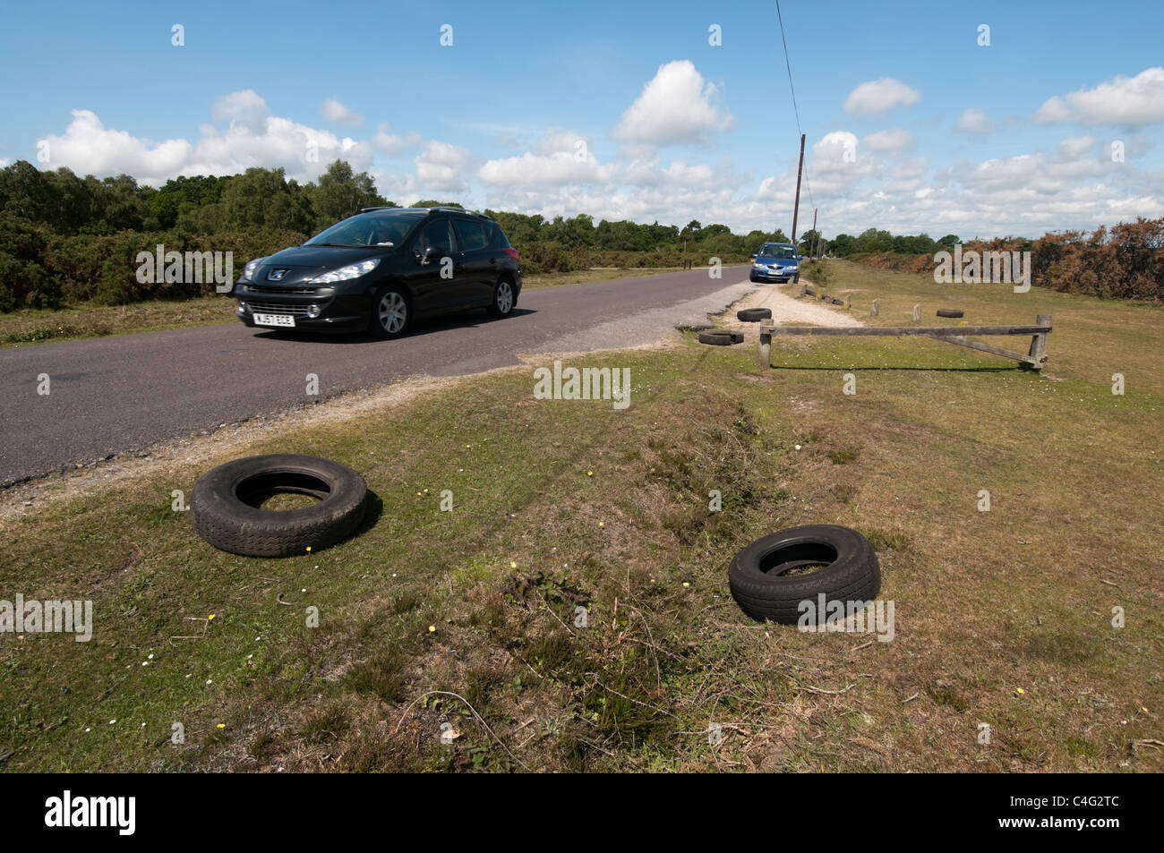 Tyres dumped on roadside New Forest Stock Photo
