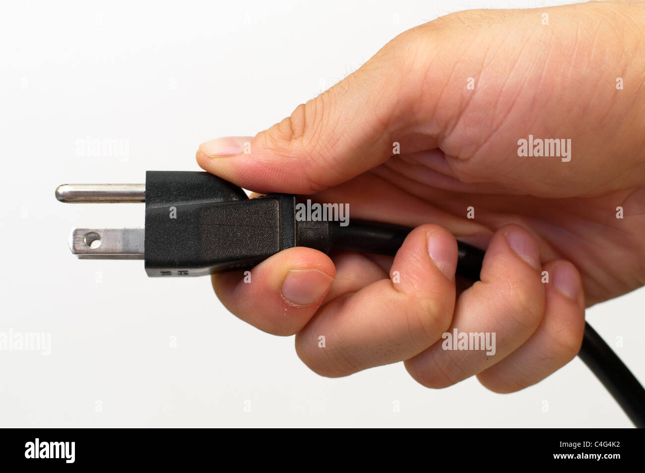 Hand holding an electrical cord Stock Photo Alamy