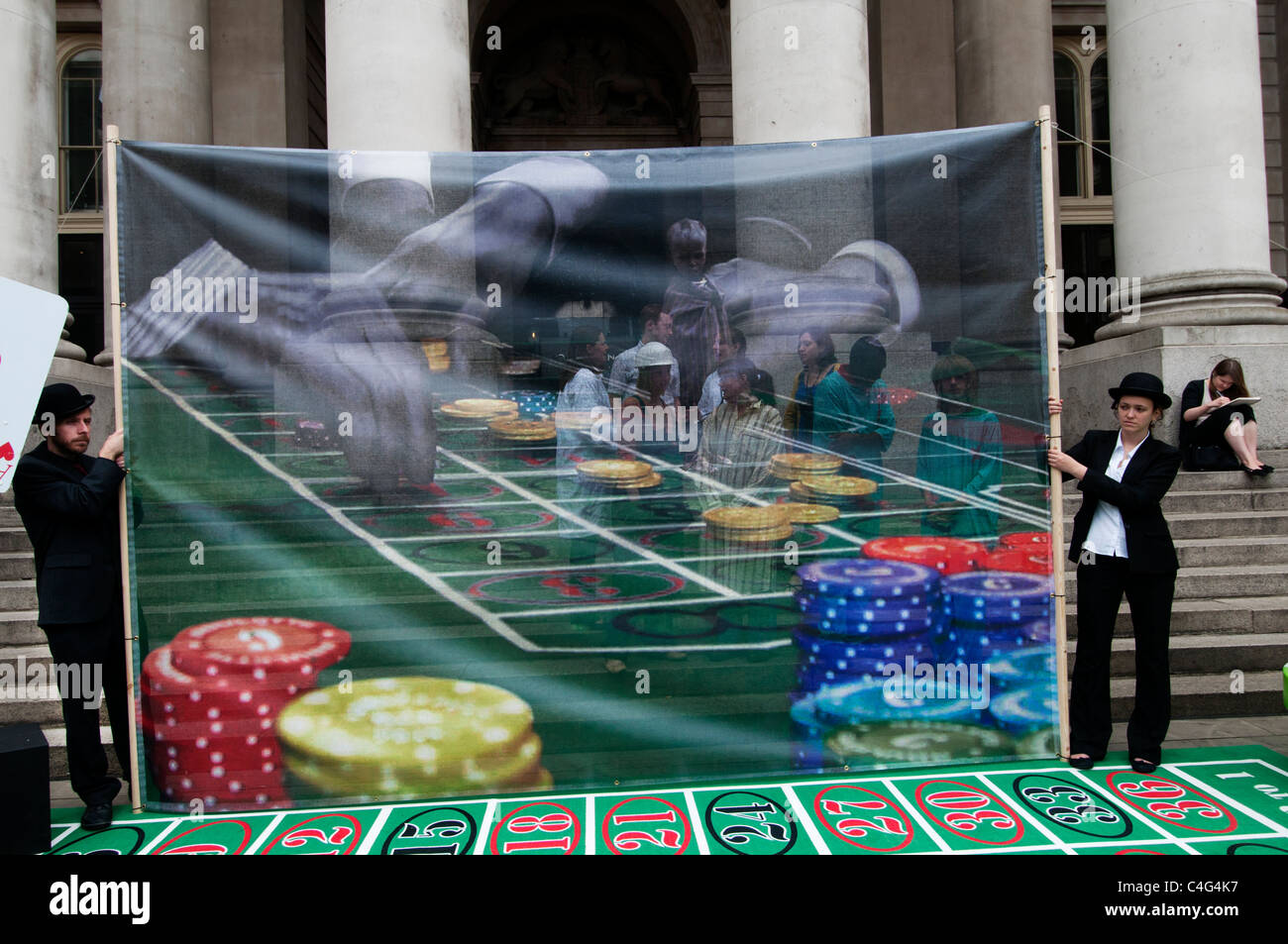 Robin Hood tax Campaigners today set up a giant roulette table in the City of London to protest against bankers’ Stock Photo