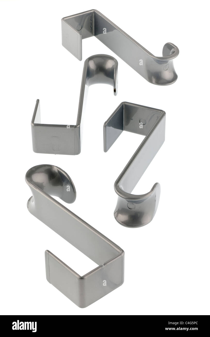 Four grey plastic overdoor hooks Stock Photo Alamy