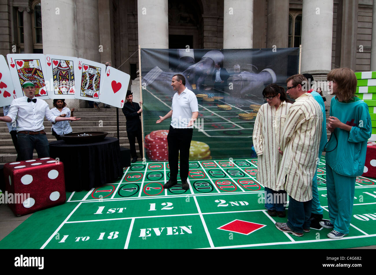 Robin Hood tax Campaigners today set up a giant roulette table in the City of London to protest against bankers’ Stock Photo