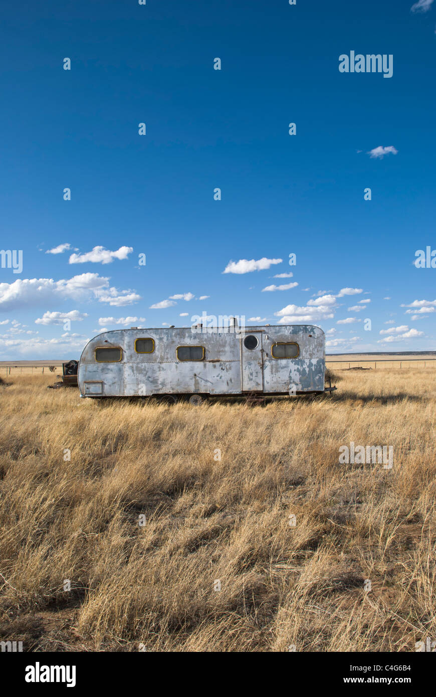 An old rusty trailer sits alone on the high plains of Eastern New Mexico. Stock Photo