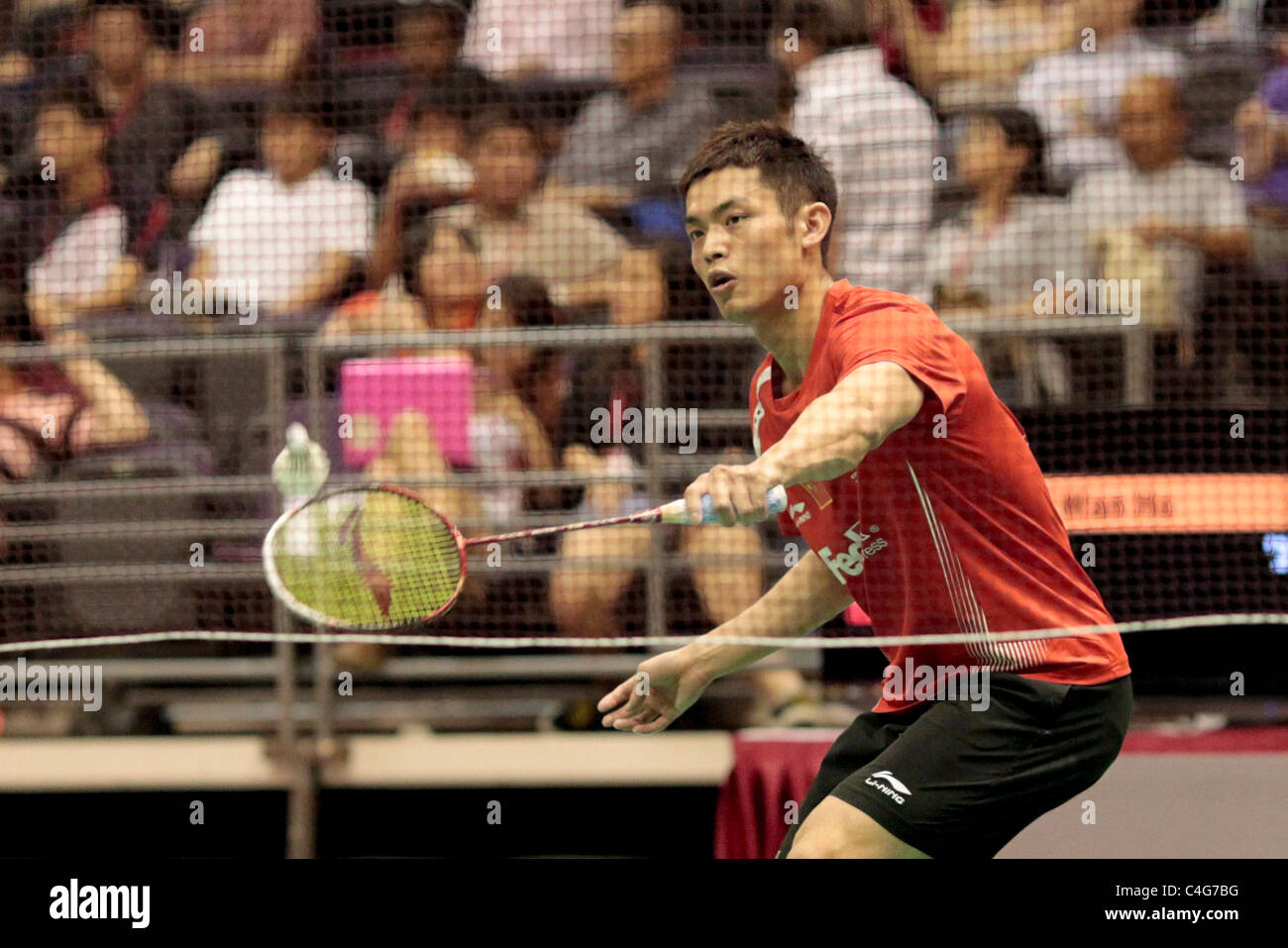 Lin Dan of China during the Men's Singles Round 1 of the Li-Ning Singapore Open 2011. Stock Photo