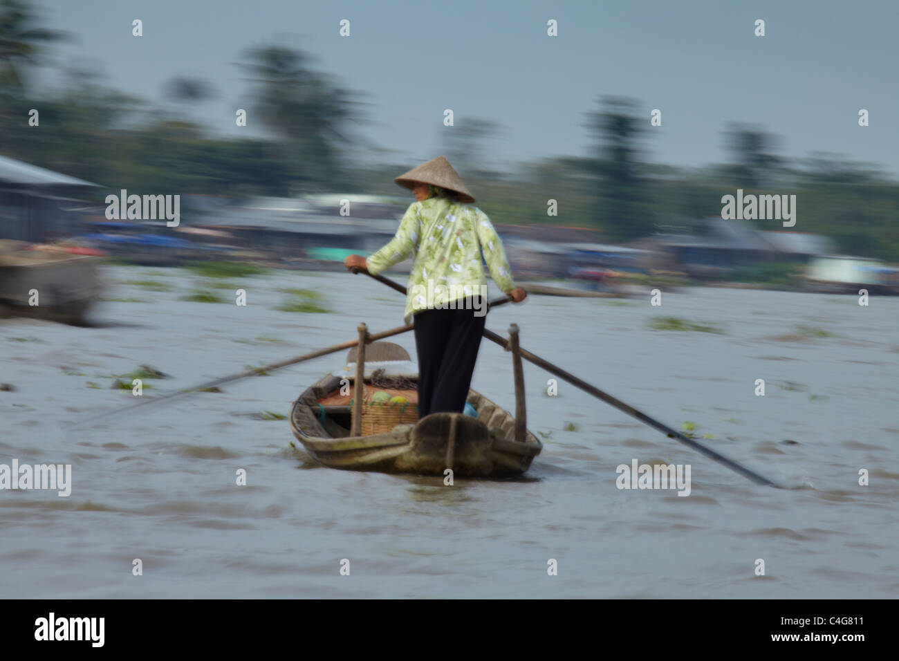 a woman rowing a boat on the Mekong River nr Can Tho, Vietnam Stock ...
