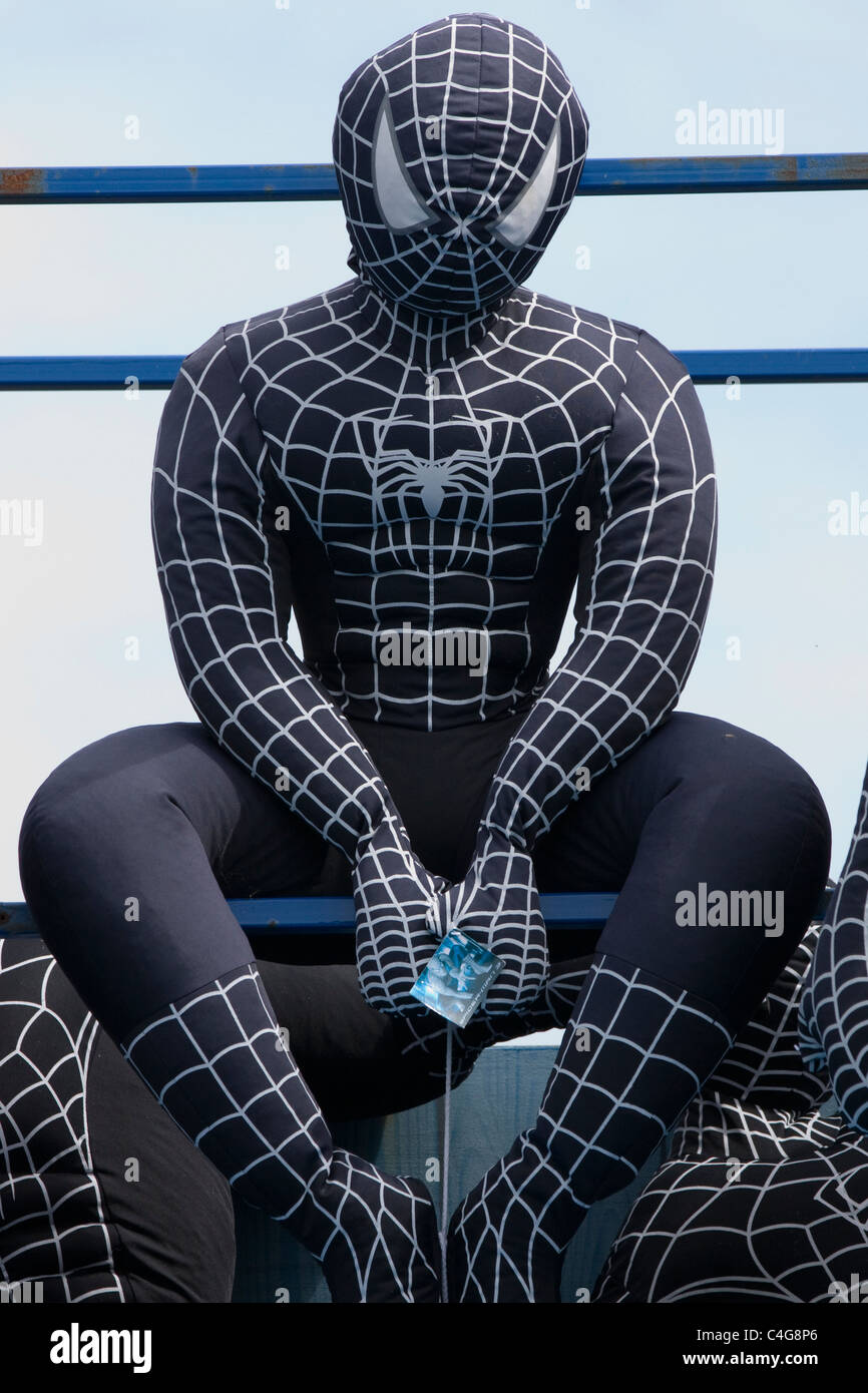 Spider man as Venom  sat on a seat Stock Photo