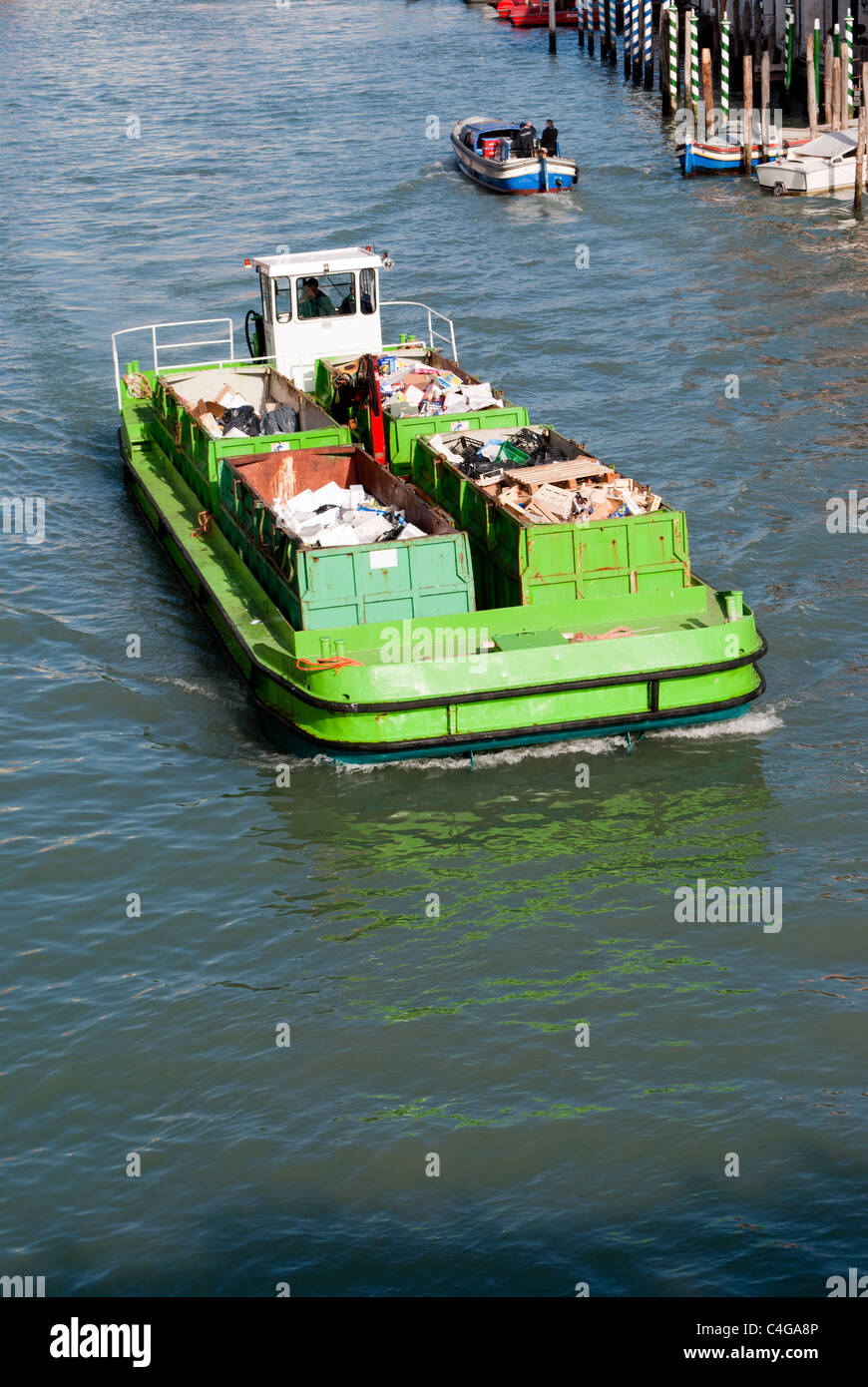 Empty boat transporting garbage cruising hires stock photography and