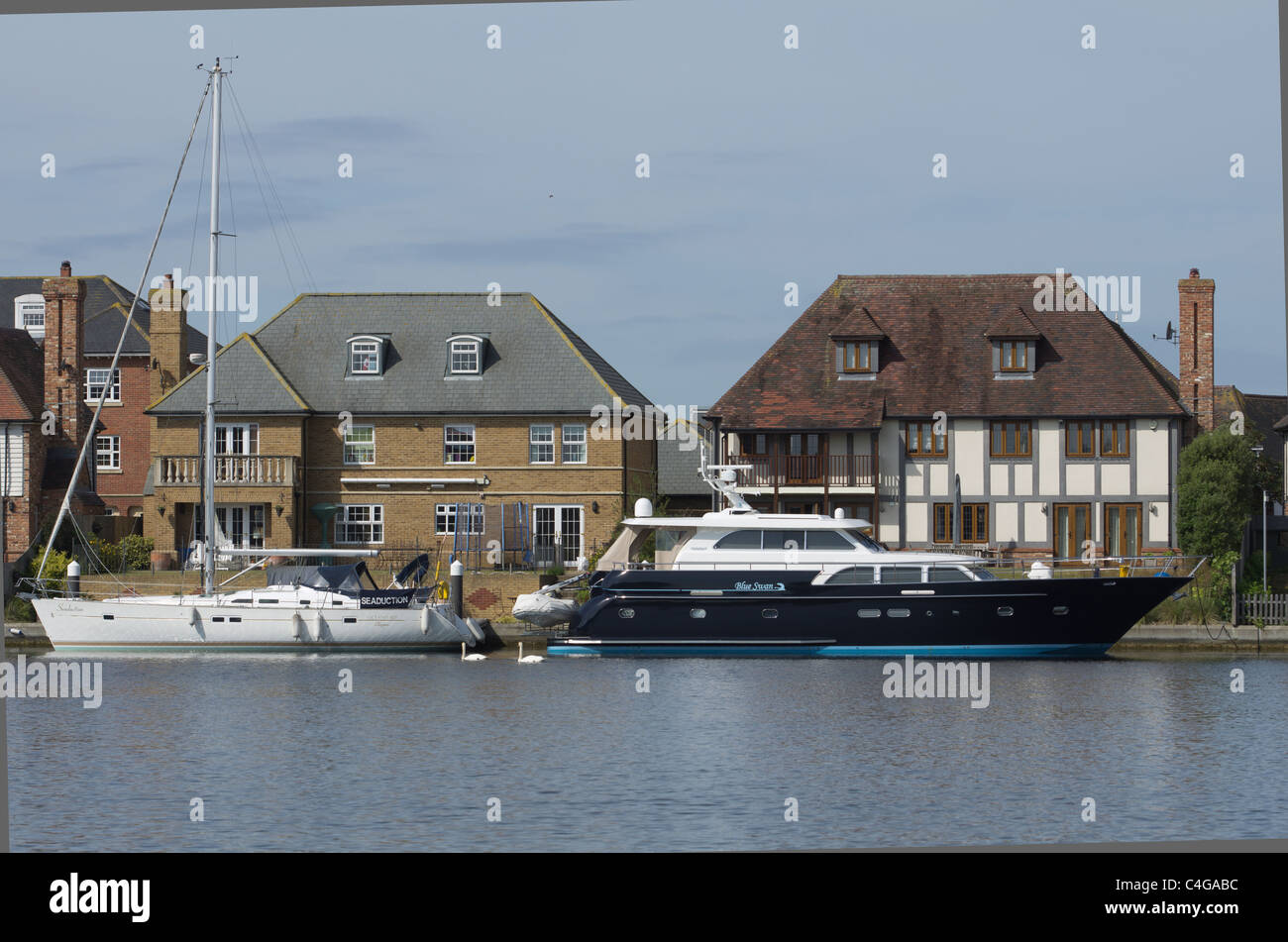 luxury houses with boats at Auckland Quay Sovereign Harbour North