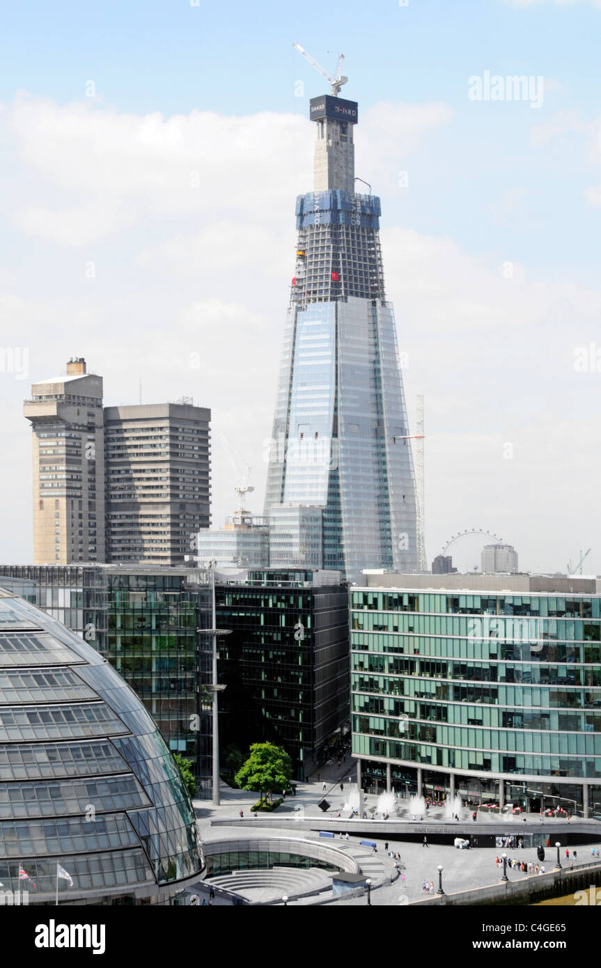 Shard building under construction and Guys Hospital tower beyond Stock Photo