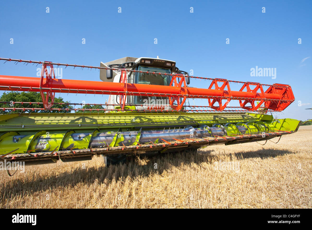 Combine harvester with raised cutting blades Stock Photo Alamy