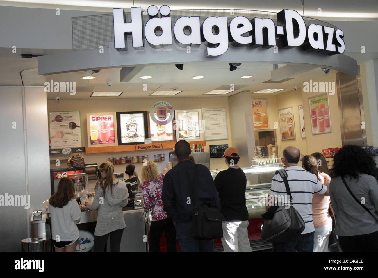 Miami Florida International Airport MIA,terminal,gate,line,queue,Haagen Dazs,ice cream,passenger passengers rider riders,visitors travel traveling tou Stock Photo