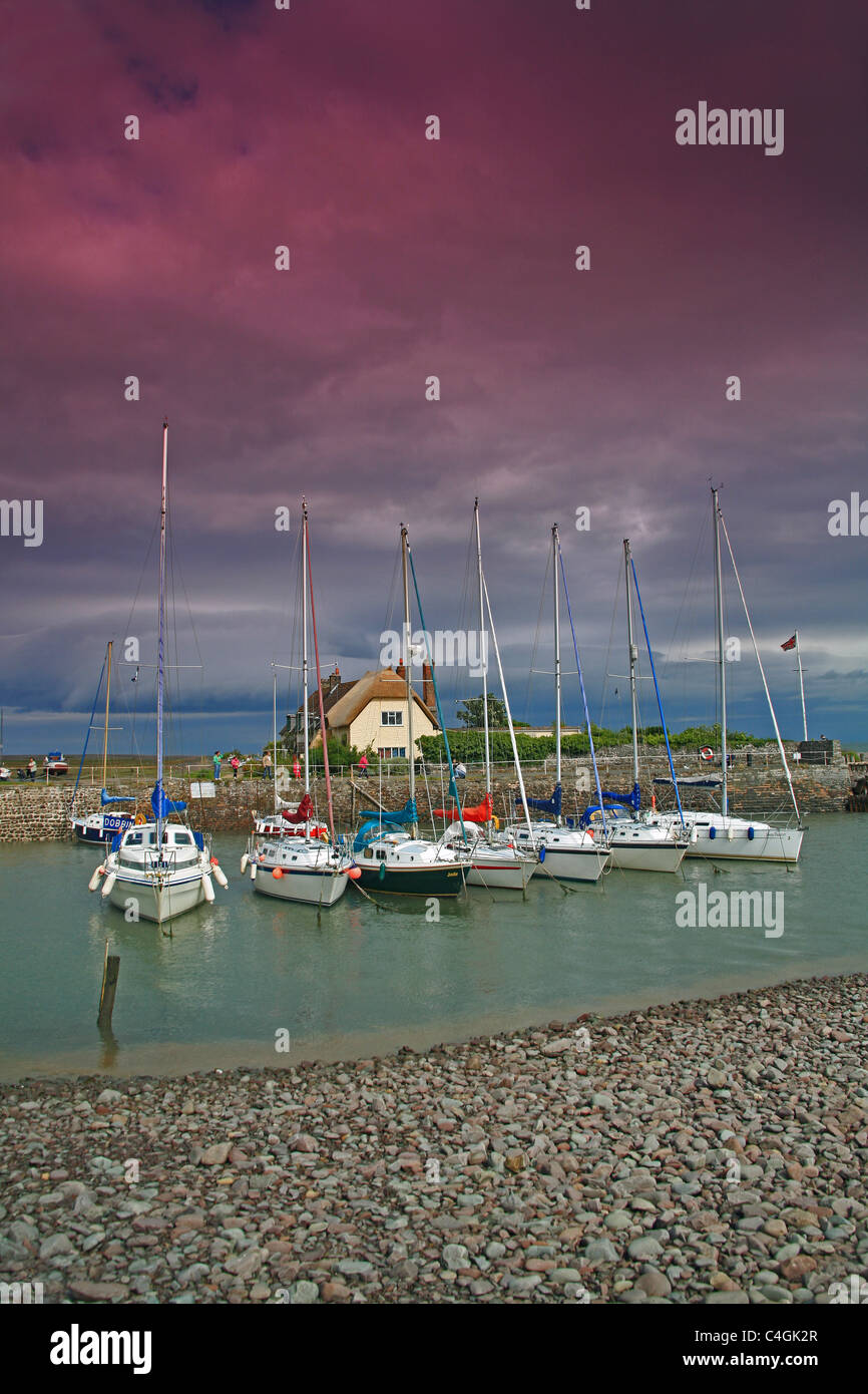 A collection of yachts moored at the small picturesque harbour of Porlock Weir on the Bristol Channel, Somerset, England, UK Stock Photo