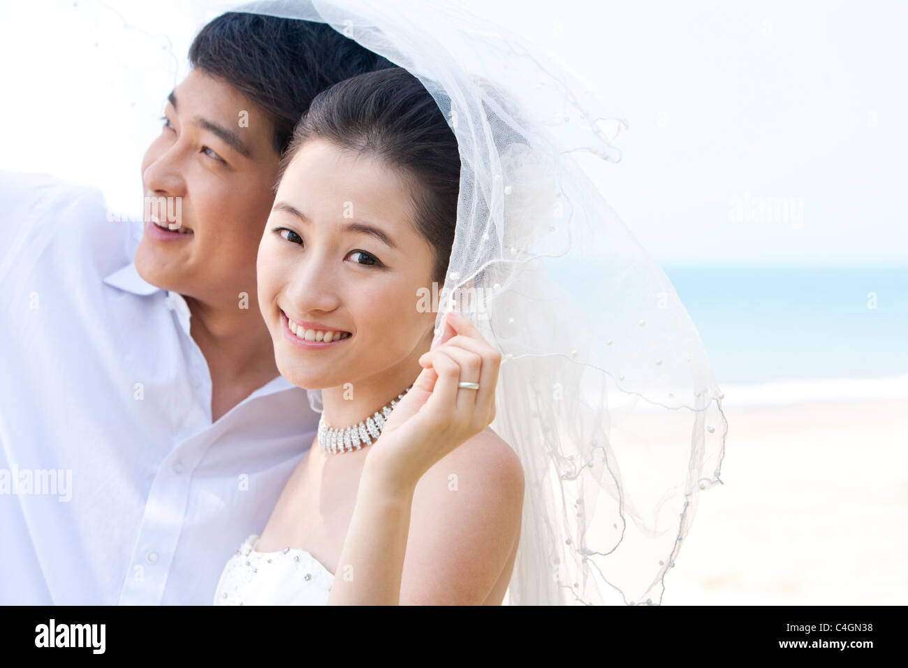 Happy newlyweds standing head hi-res stock photography and images - Alamy
