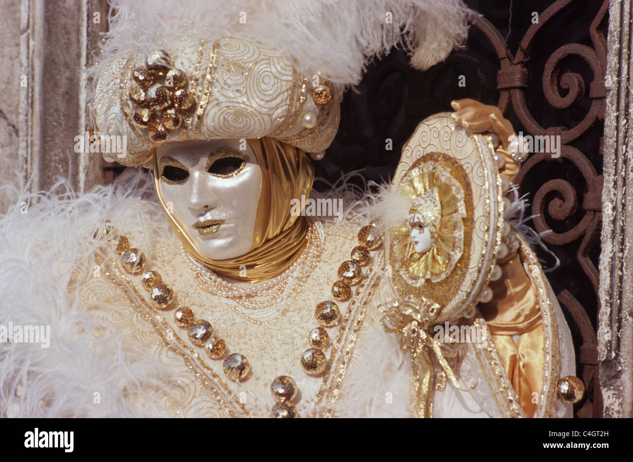 Carnevale Venezia: White and golden mask with Mirror Stock Photo