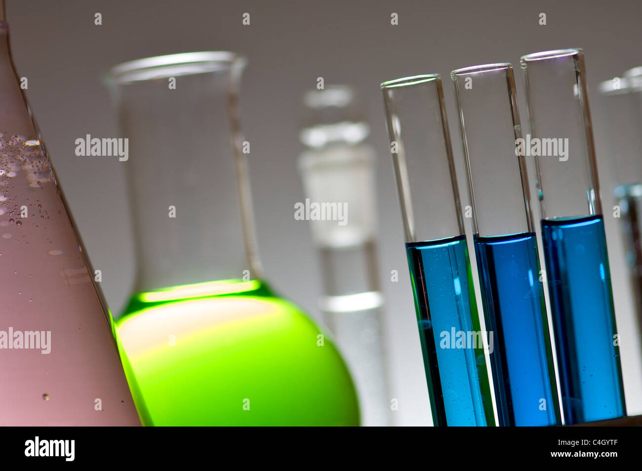 blue test tubes and bottles with white background Stock Photo Alamy