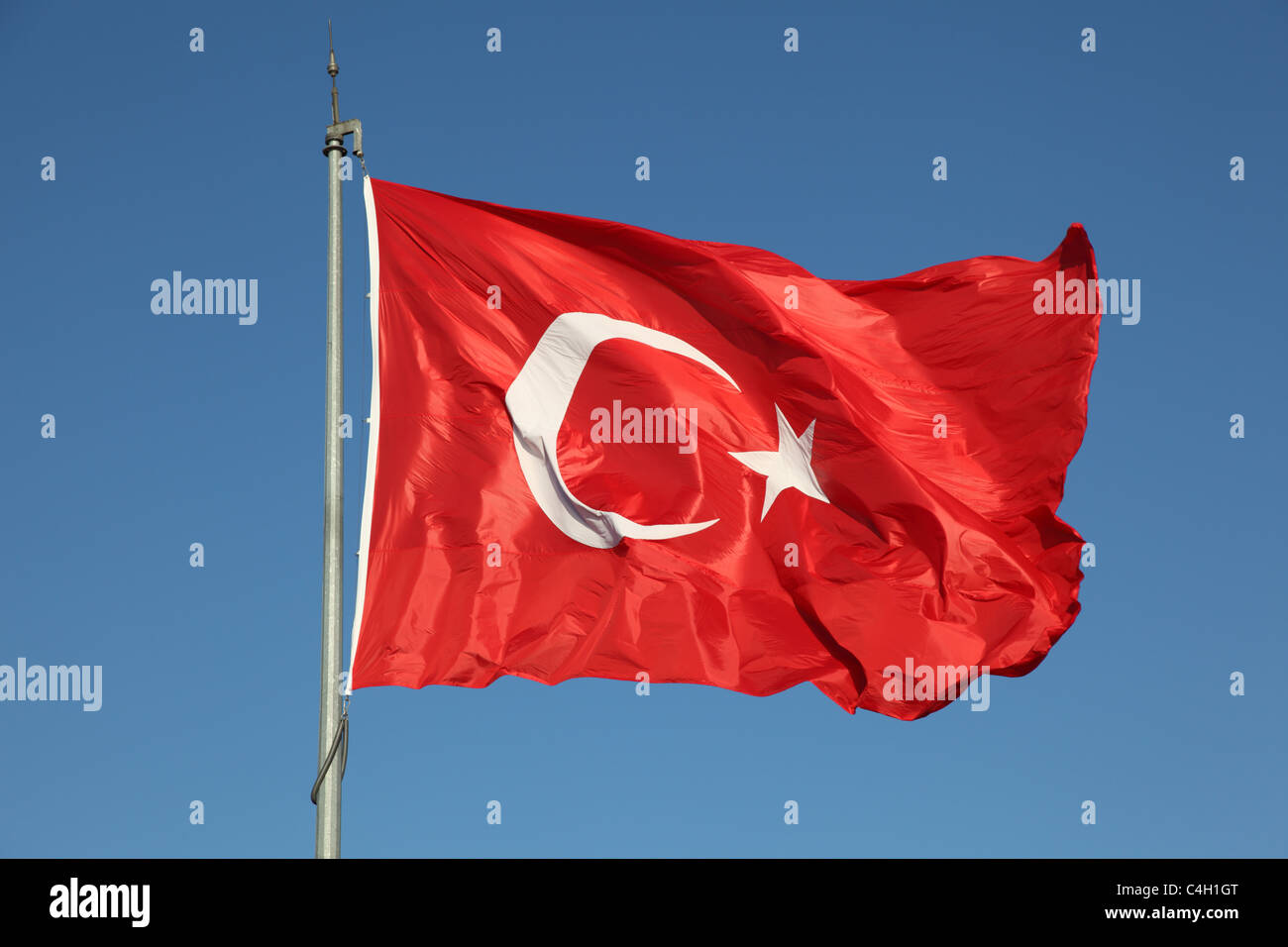 Turkish flag against a blue sky Stock Photo