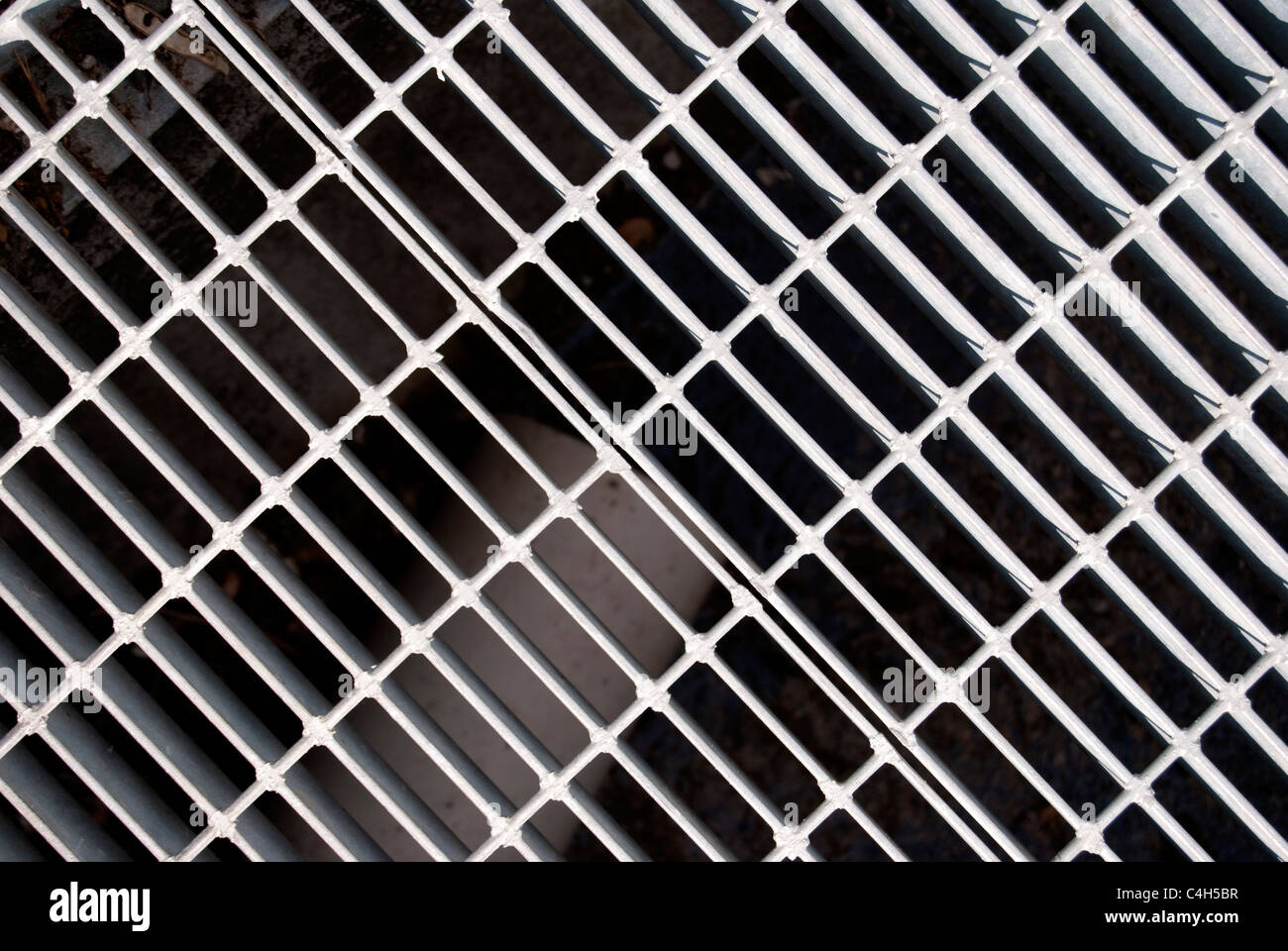 A close up of a Sewer grate Stock Photo