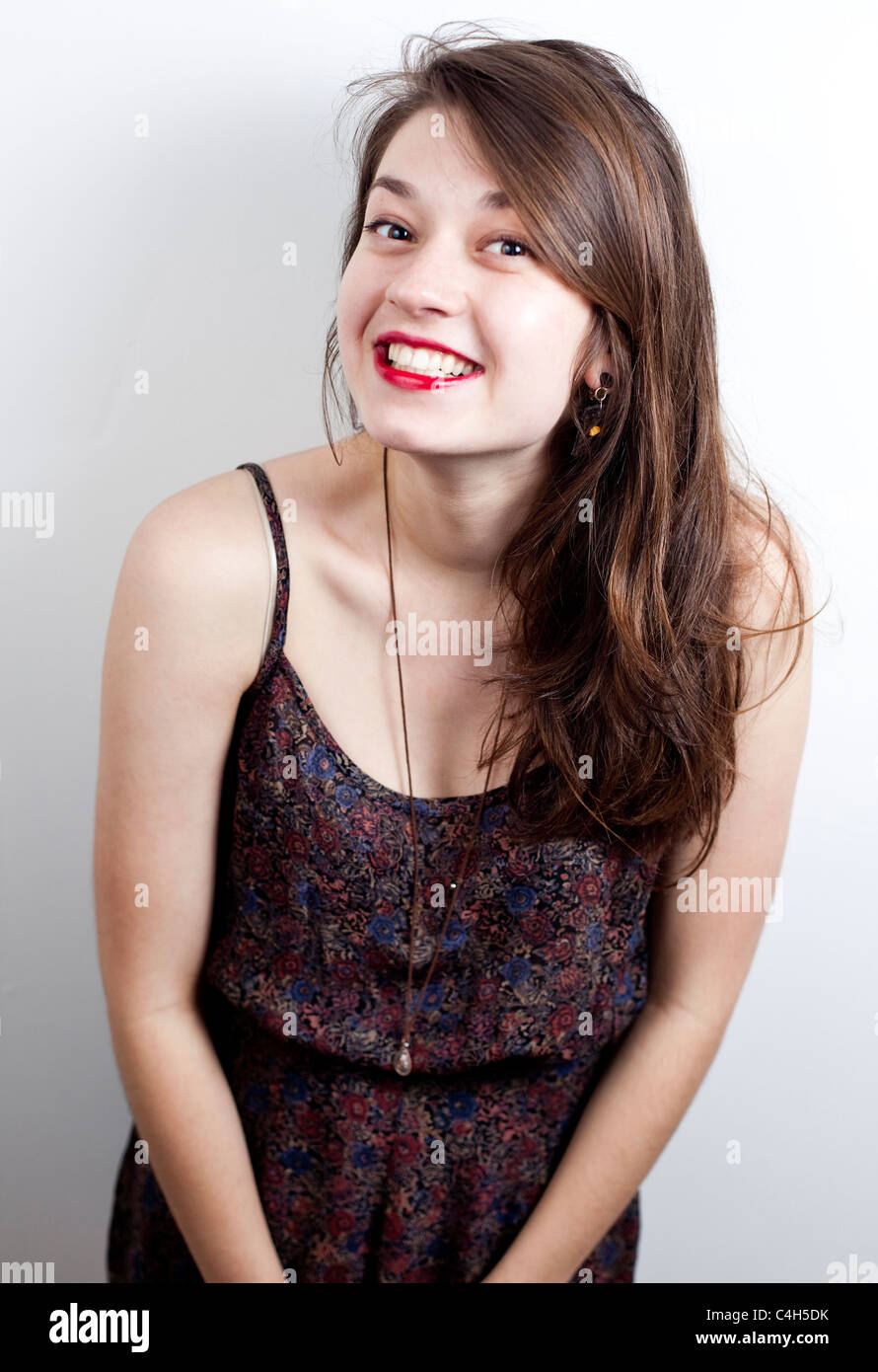 Portrait of a teenager with a cheeky smile on her face, London, England, UK Stock Photo
