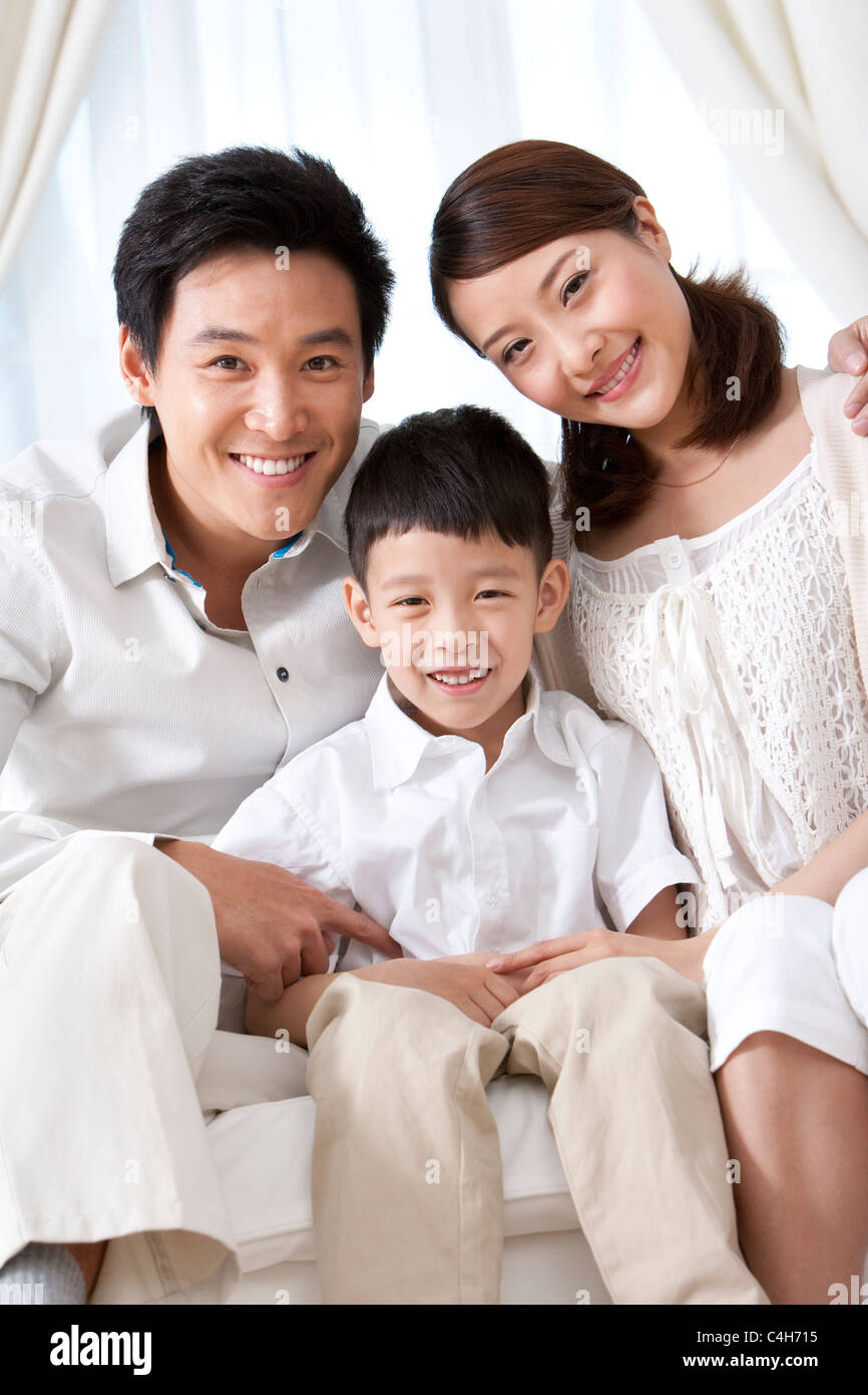 Happy Young Family Stock Photo - Alamy