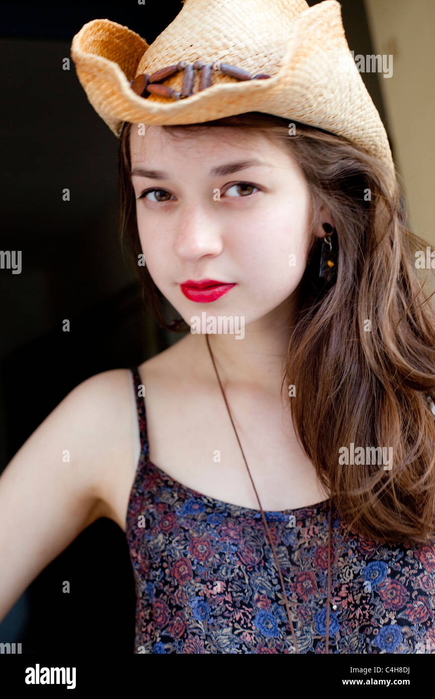 Headshot Portrait Of A Young Woman With Long Hair Wearing A