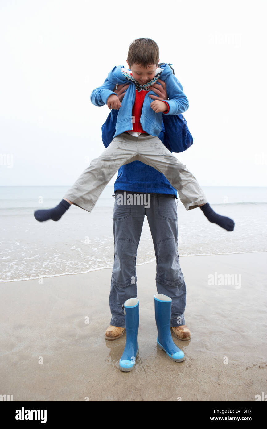 Father and son on beach Stock Photo